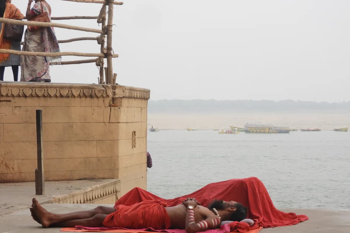 Ancient stone ghats of Kashi illuminated with countless earthen oil lamps reflecting upon the sacred Ganga