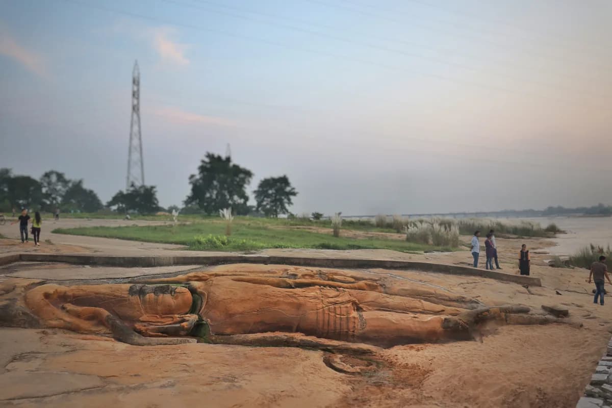 Serene stone sculpture of Anantashayana Vishnu reclining on the coils of multi-headed Sheshanaga