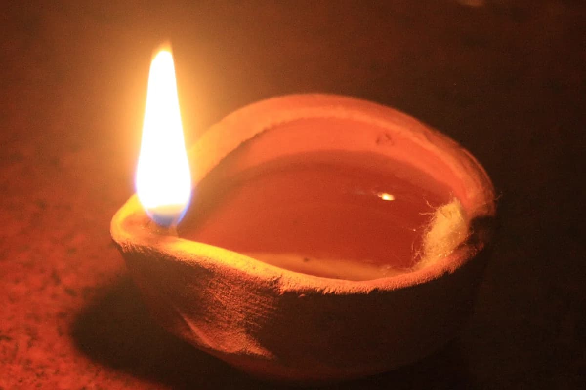 Traditional brass diyas radiating warm illumination during sacred Hindu festival celebration