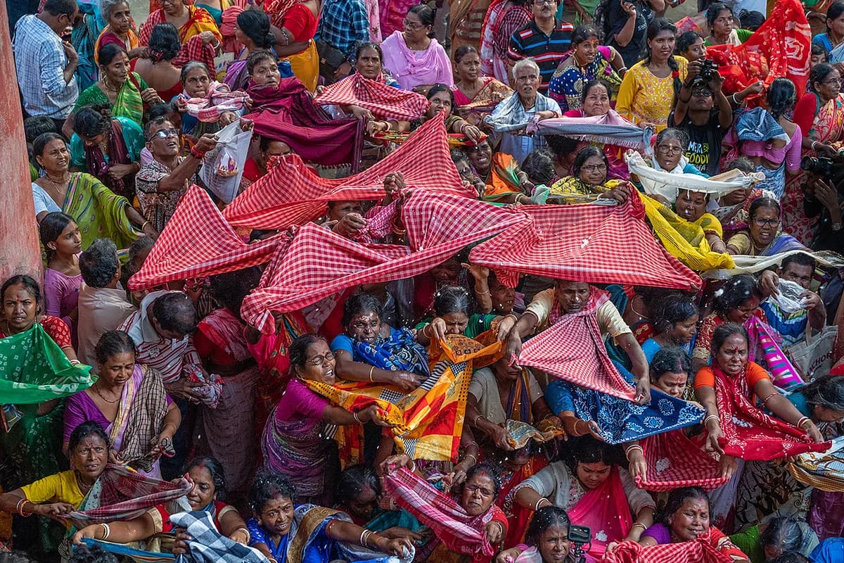 Elaborate tiers of traditional sweets, grains, fruits, and delicacies offered during Govardhan Puja