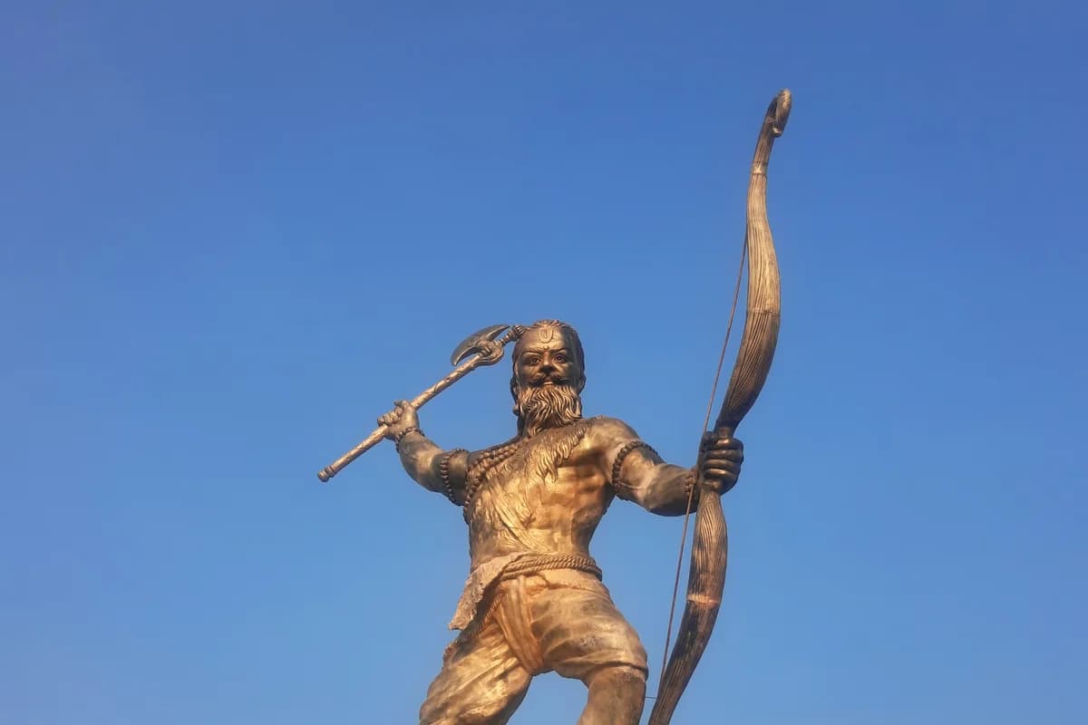 Ancient stone murti of Sage Parashurama holding the sacred battle axe (parashu) and bow