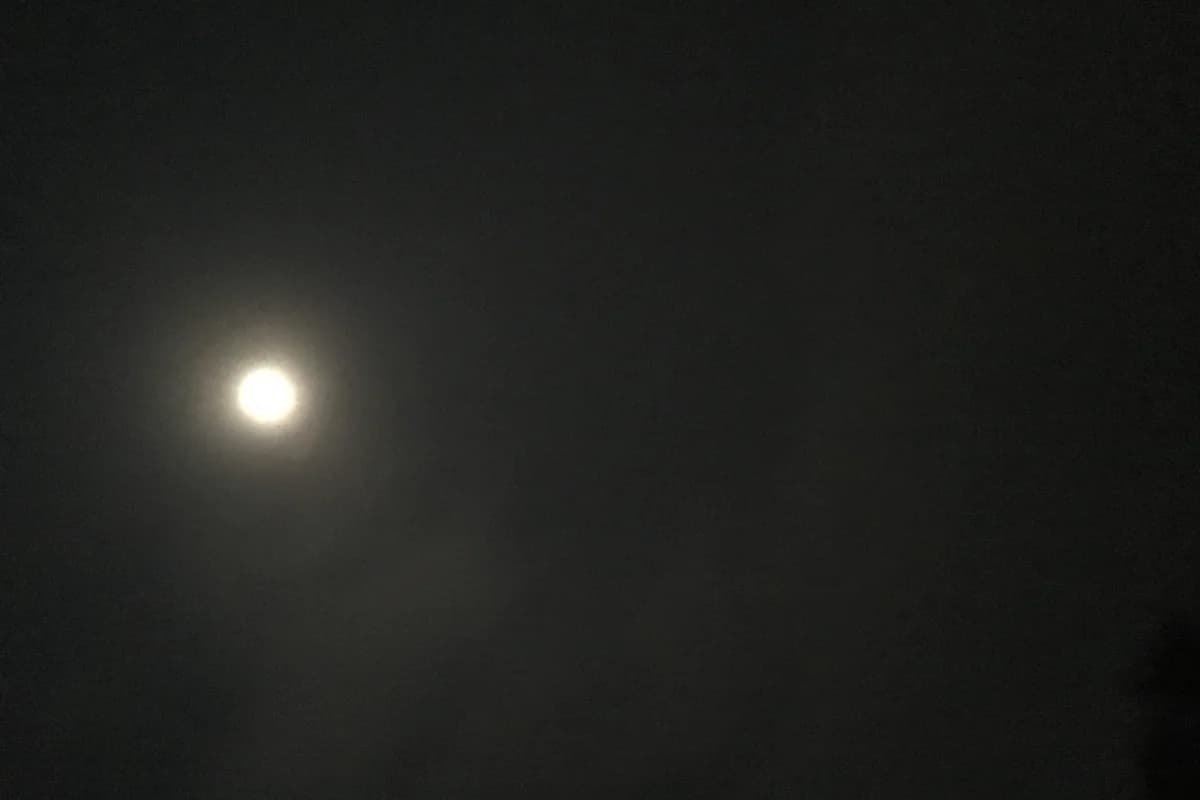 Bright radiant full moon illuminating the clear autumn night sky on Kojagiri Purnima