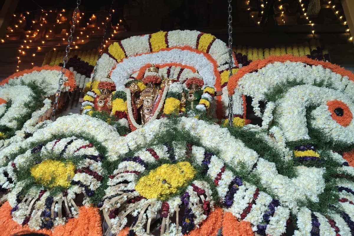 Consecrated temple portal (Vaikunta Dwara) illuminated with garlands and lamps for Mokshada Ekadashi