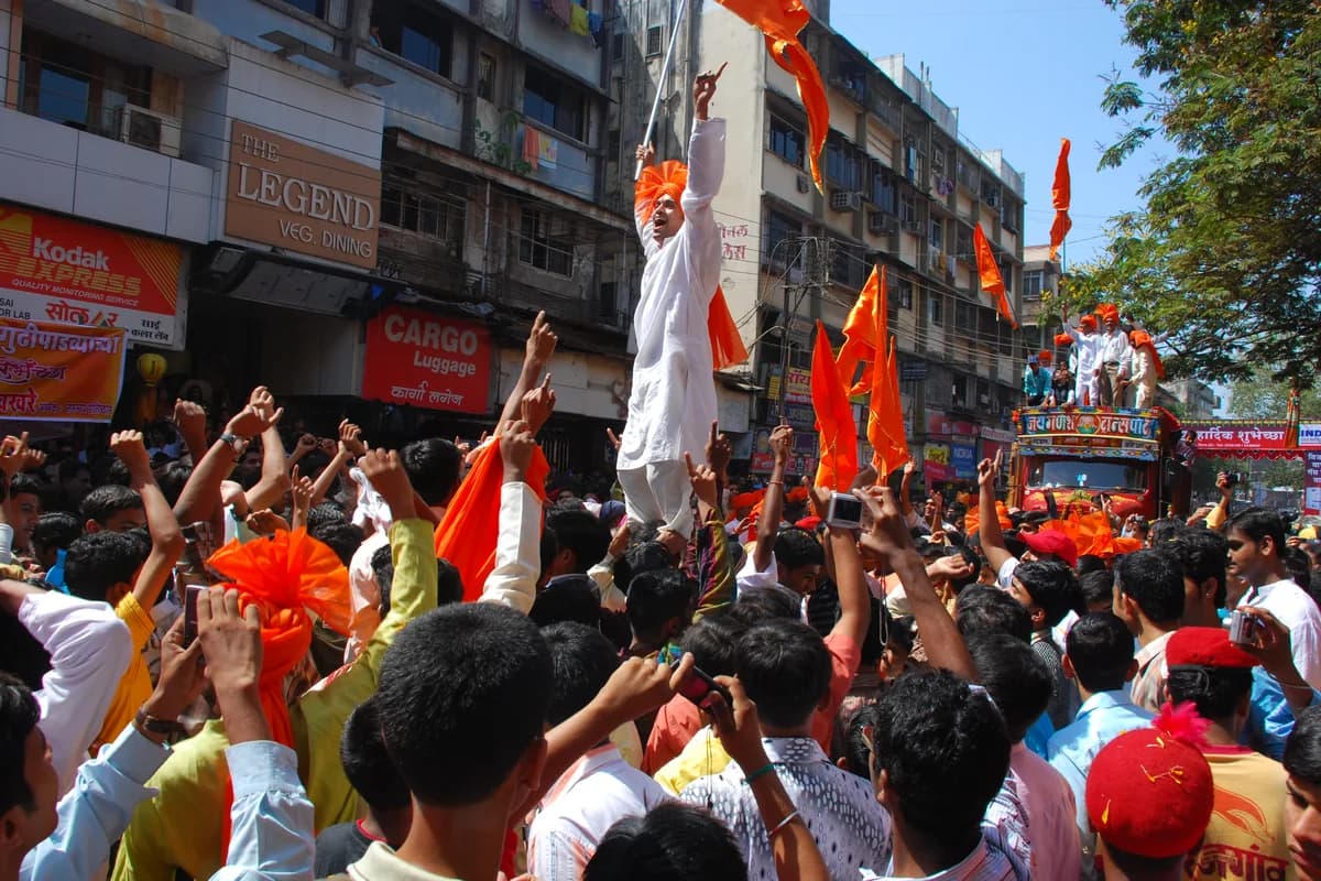 Celebration of Marathi New Year with traditional attire, saffron flags, and festive cheer